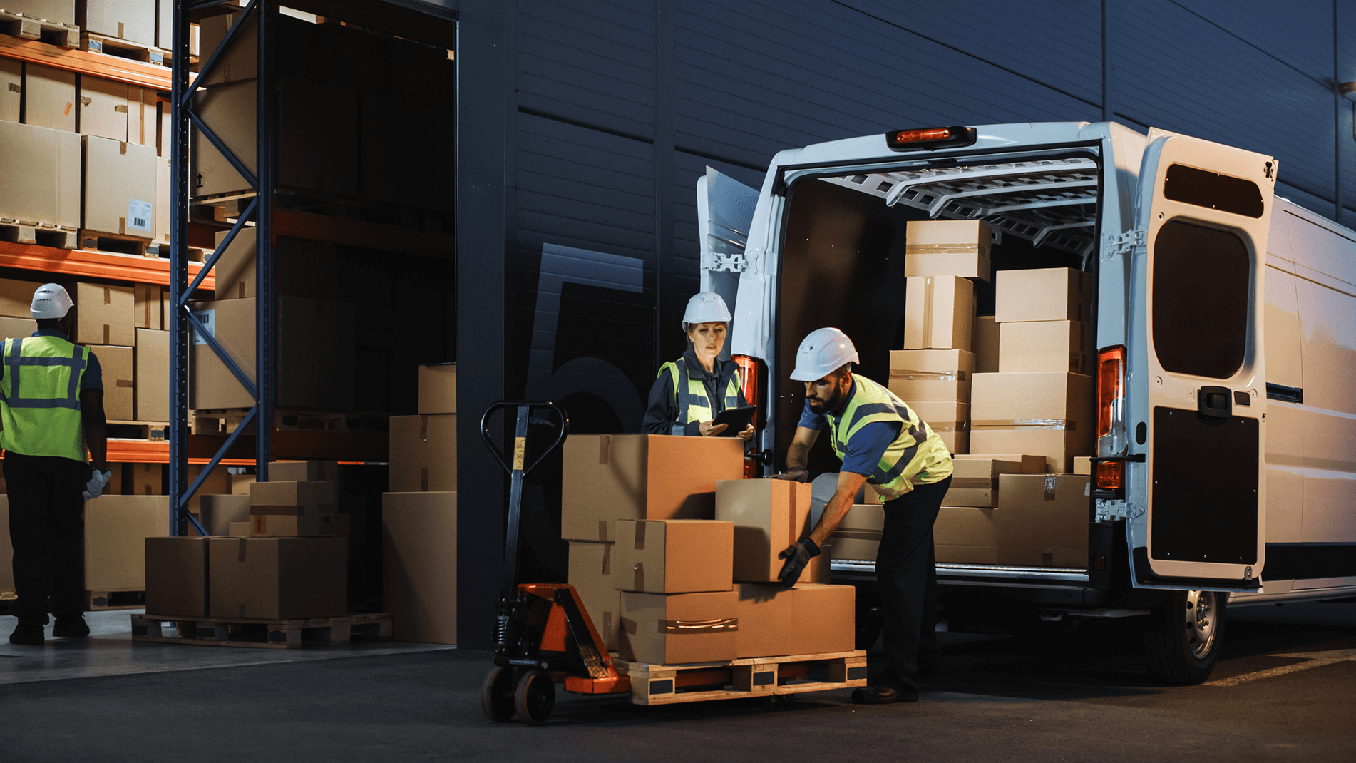 Image of workers loading a truck with boxes.