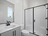 bathroom with black hardware and white countertops