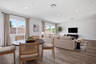 dining area with neutral floors near great room