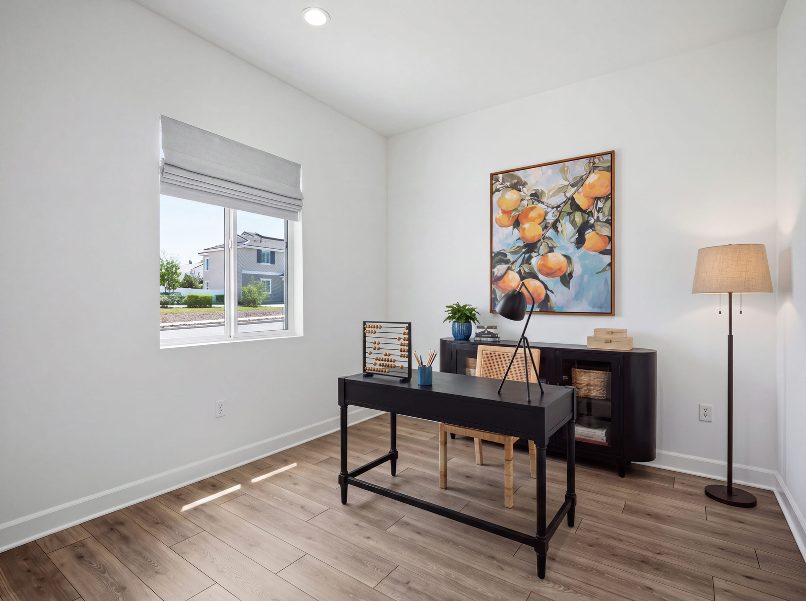 study with neutral floors and large window