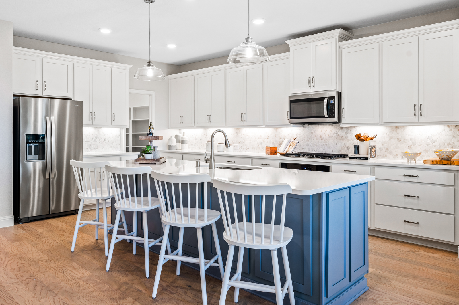 kitchen with white and blue cabinets 