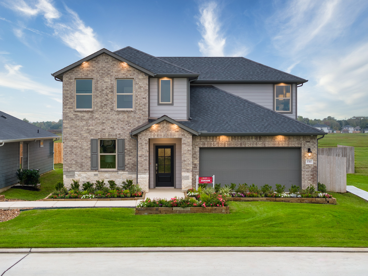 home exterior with brick and stone