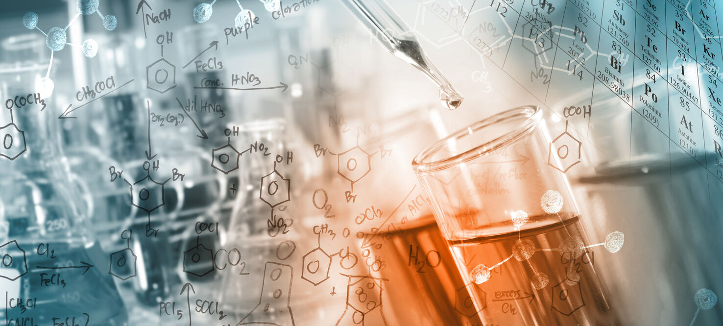 Researcher dropping the clear reagent into test tube with periodic table and chemical equations background, for reaction testing in chemical laboratory.