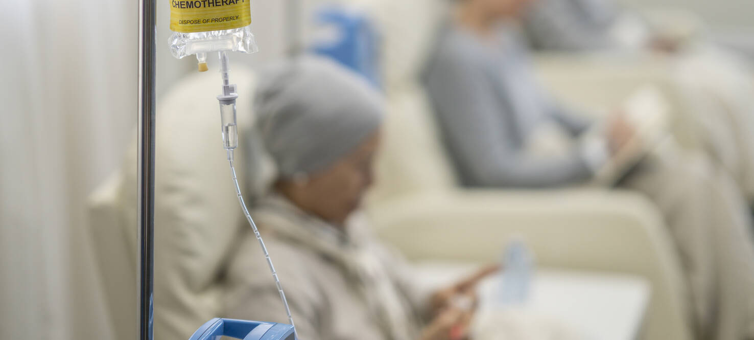 Photo of several patients in chemotherapy chairs receiving treatment