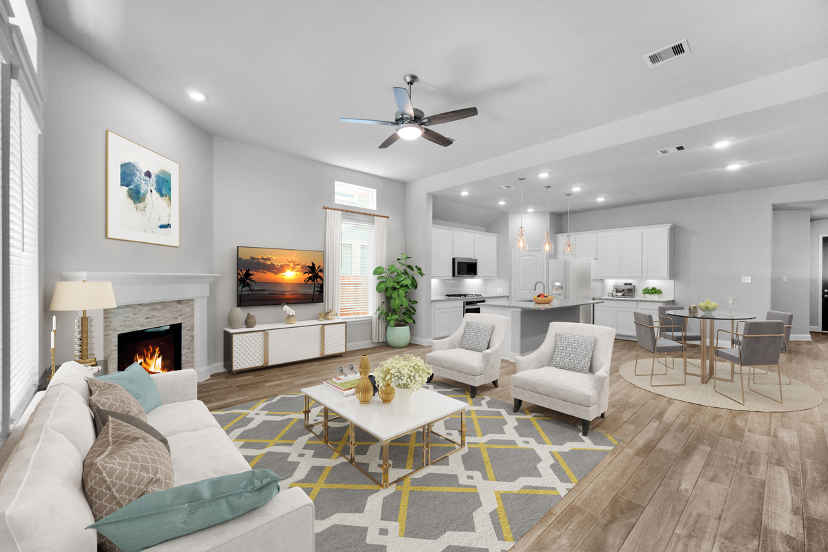 open-concept great room with cozy fireplace 