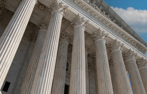 Front of a courthouse with marble columns