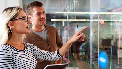 Colleagues working and brainstorming in office