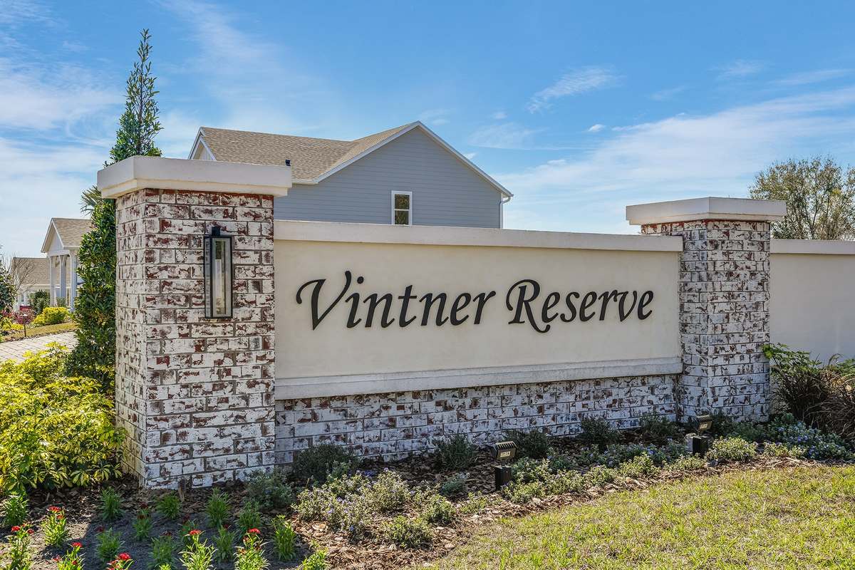 community entrance sign with brick and lantern