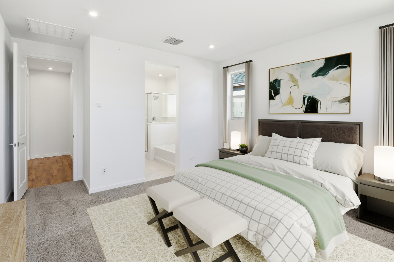 spacious room with a large couch, white grid pattern covers, and a white bed bench