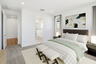 spacious room with a large couch, white grid pattern covers, and a white bed bench