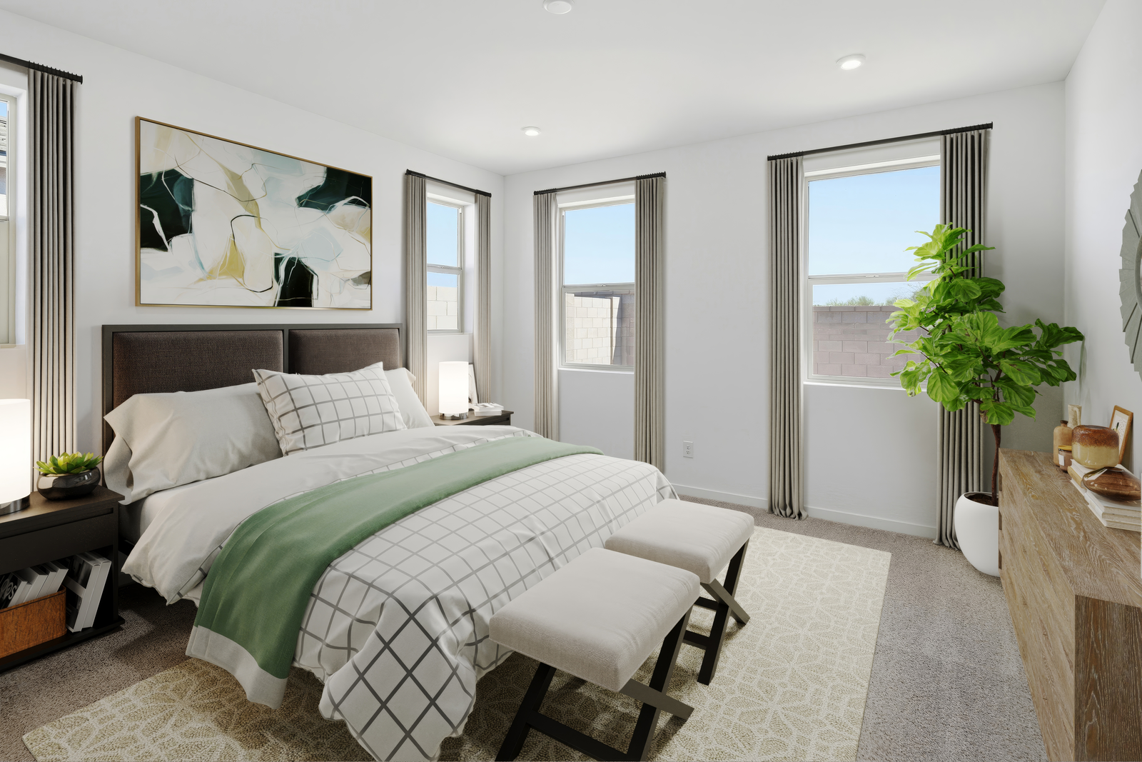 spacious room with a large couch, white grid pattern covers, and an indoor plant
