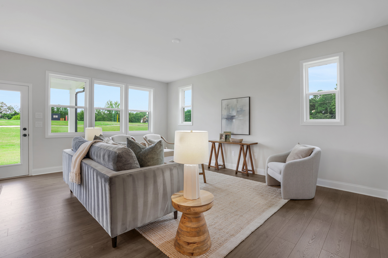 great room with hard surface flooring and windows