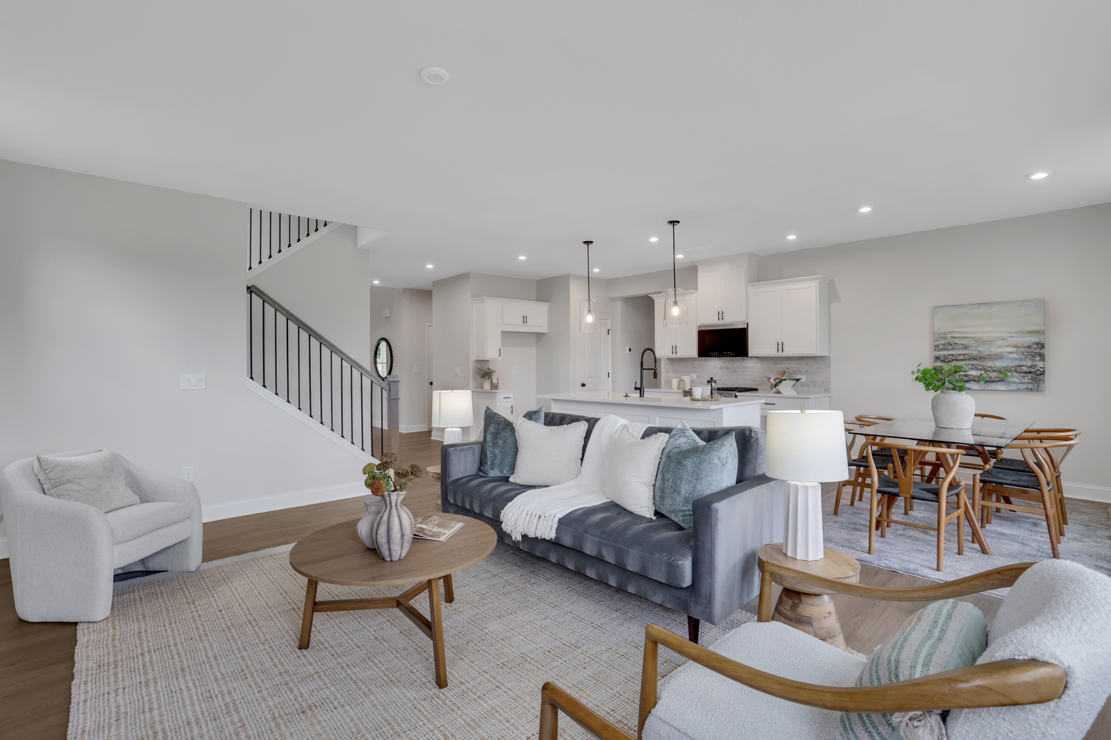 great room, dining room, and kitchen in an open-concept space