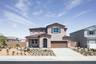 exterior of two-story home with brown garage and desert landscaping