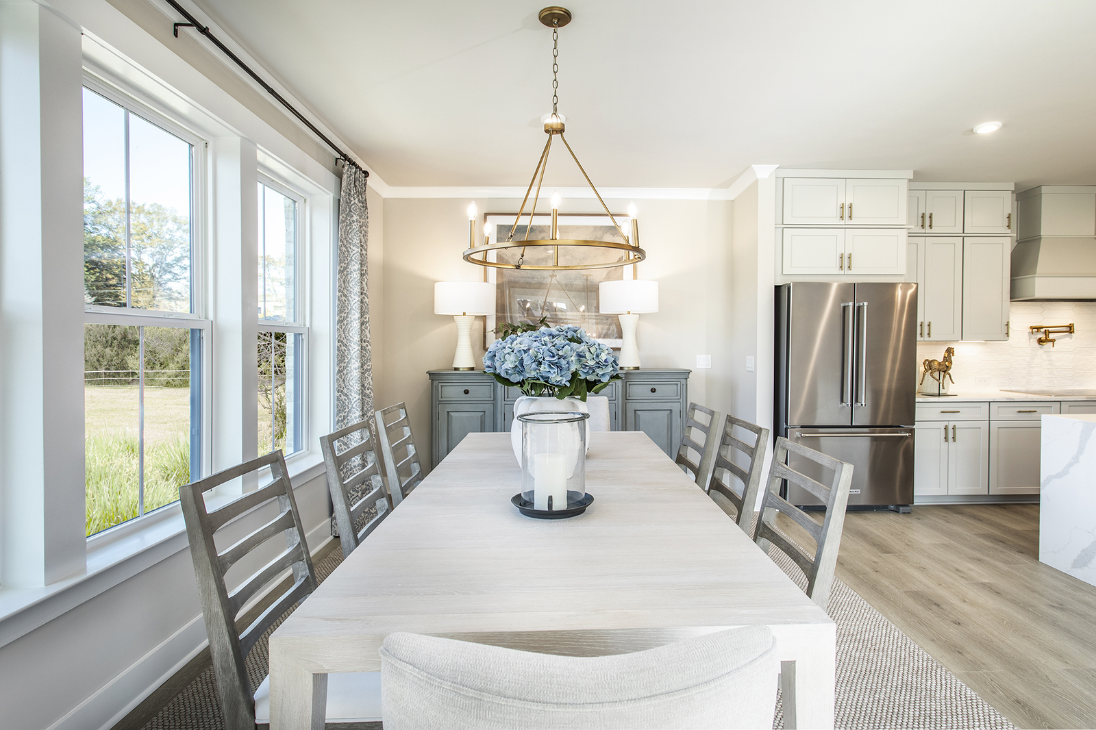 dining room with light flooring and 8-person table and chairs