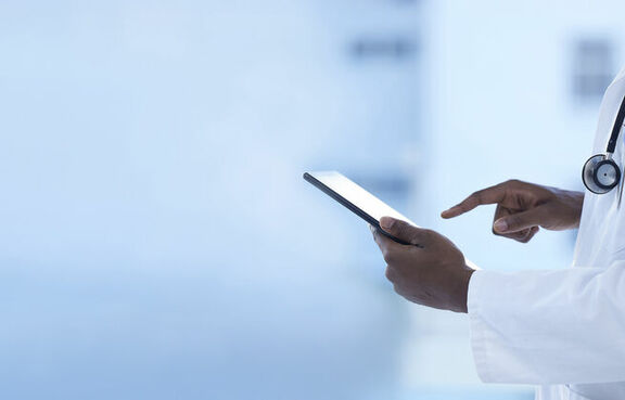 Doctor with tablet in hospital for healthcare