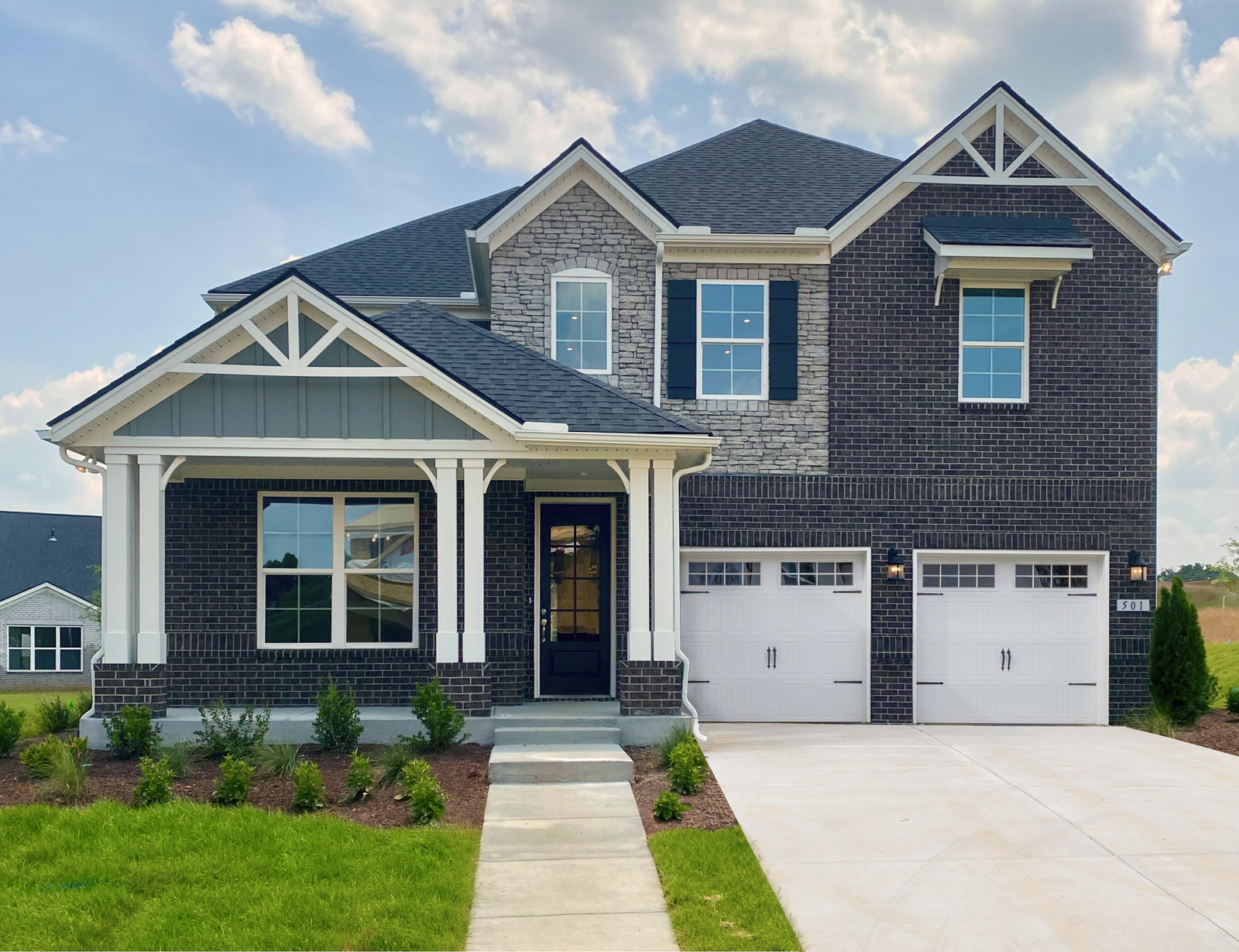 home exterior with front porch seating and garage