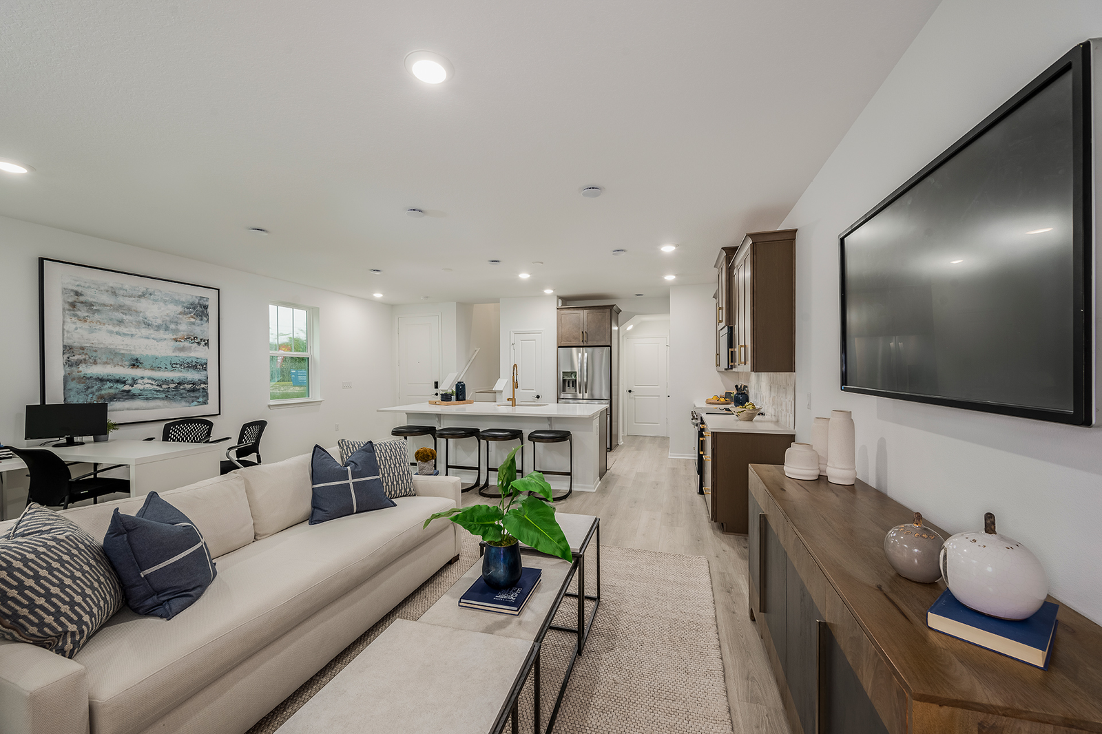 great room with white sofa and large area rug