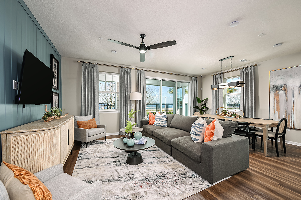 great room with gray couch and accent rug