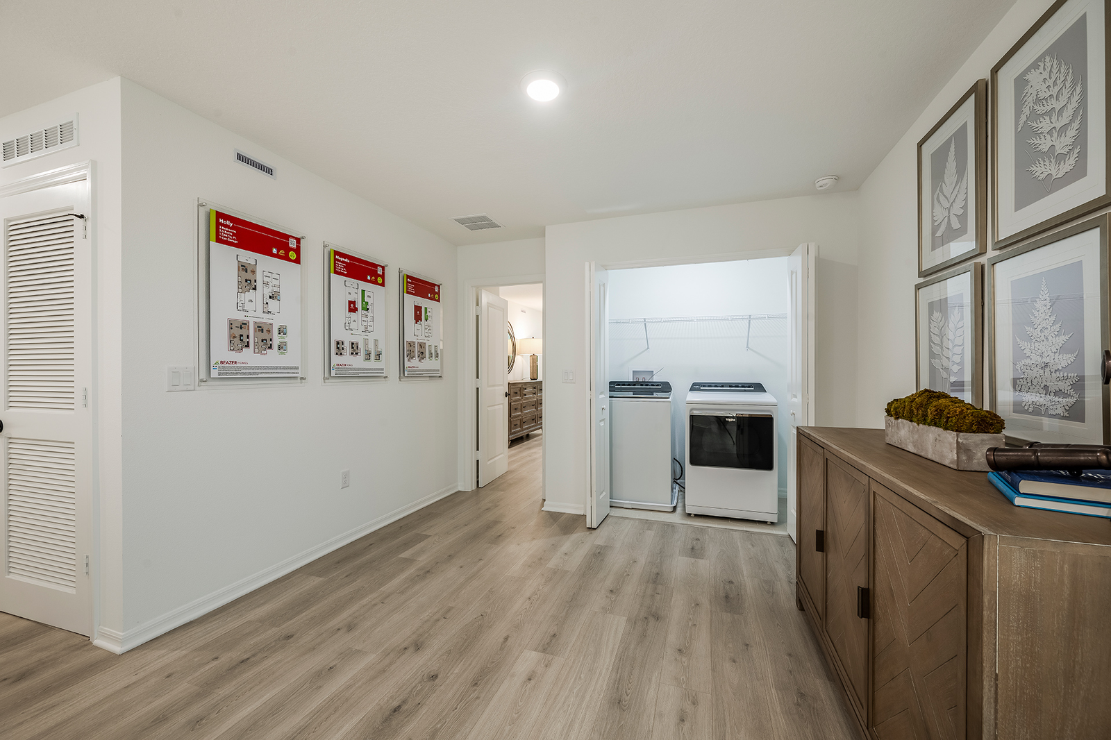 loft with vinyl flooring and laundry closet
