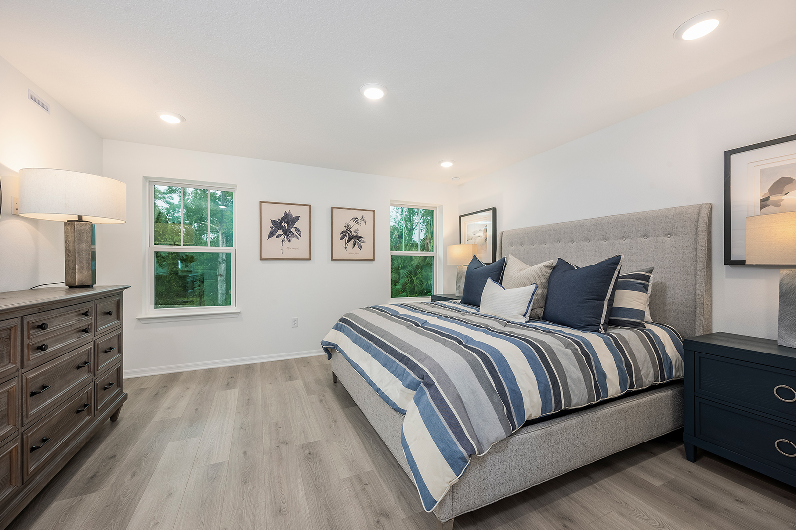 primary bedroom with king sized bed and two nightstands