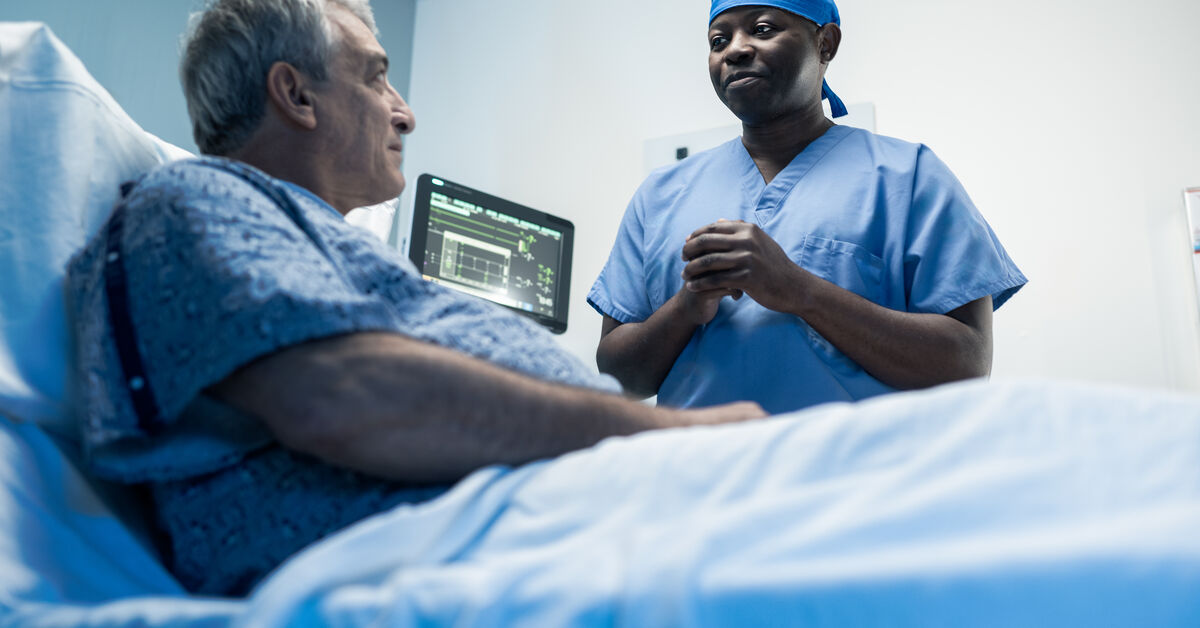 Dr. Etame speaks with a patient