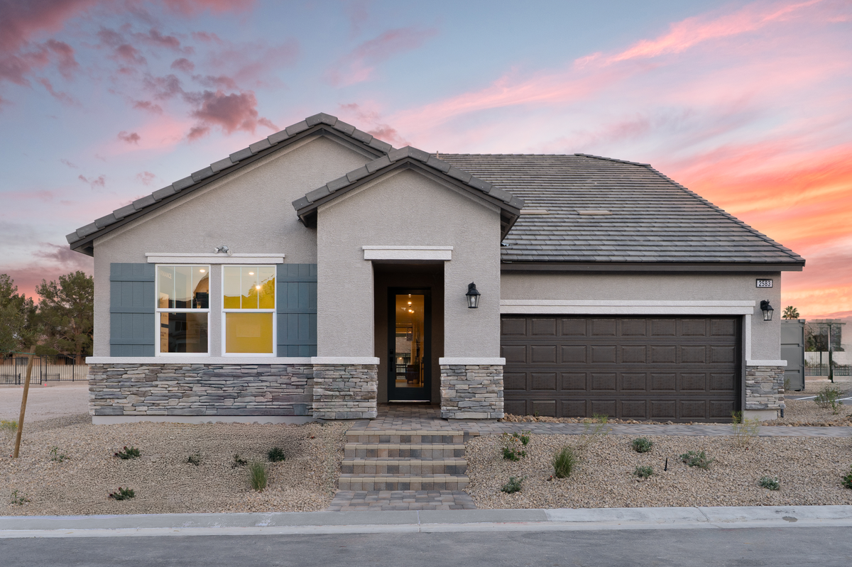 single-story home with brick pavers 