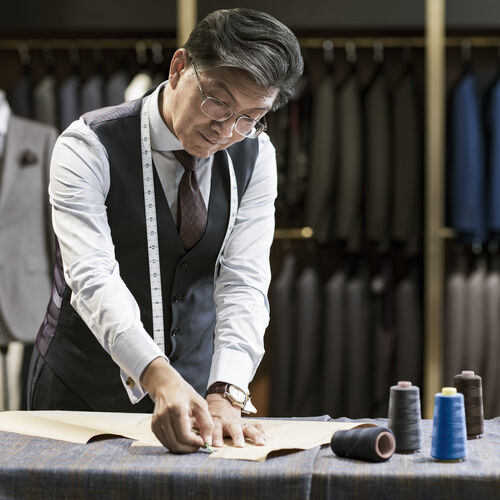 A tailor working with occupational lenses