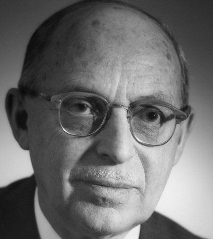 Black and white portrait of George J. Klein, a Canadian inventor, wearing glasses and a suit.