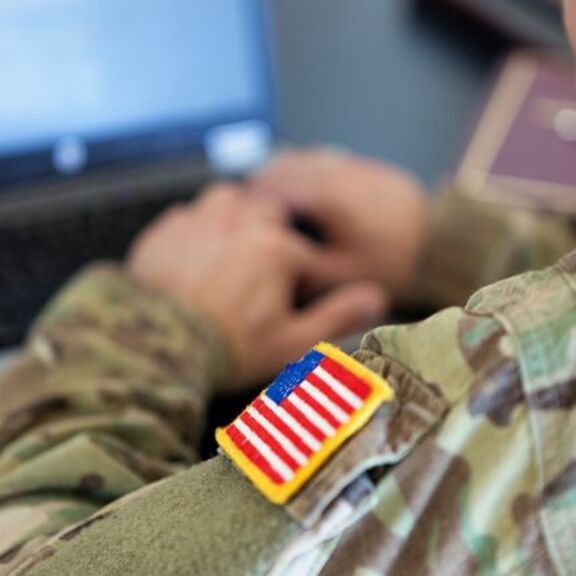 Close-up of US flag patch on servicemember's uniform