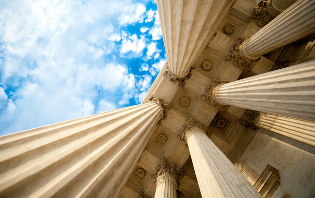 Upwards view of government building columns