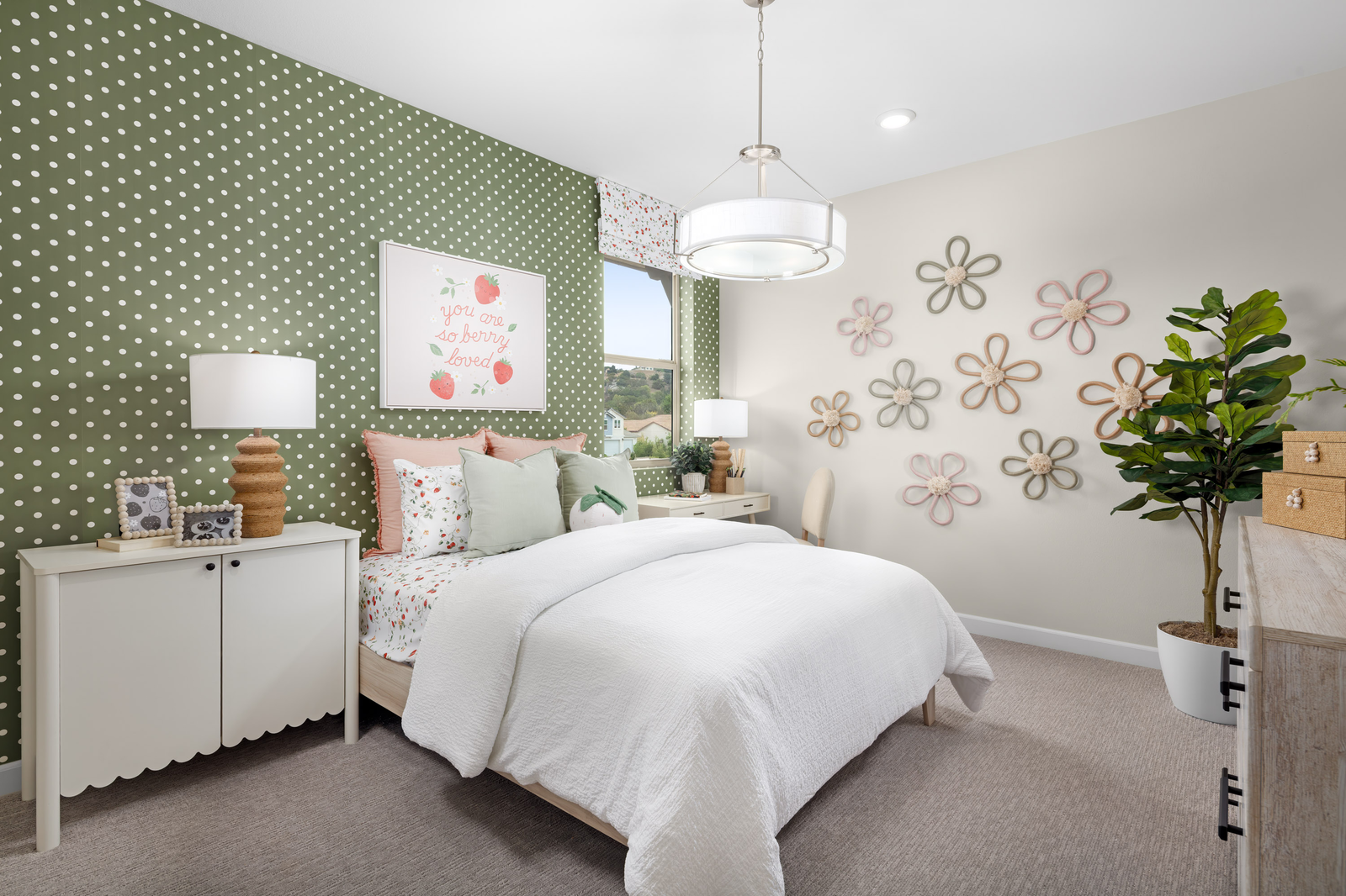 secondary bedroom with a green polka dot wall