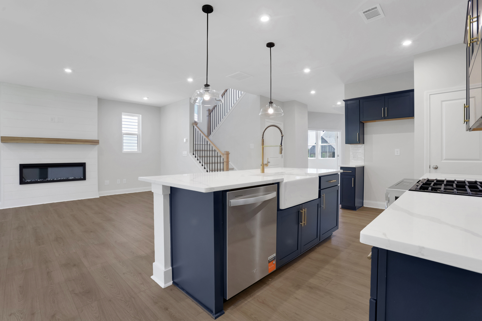 kitchen with navy cabinets and quartz counters