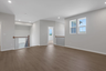 loft with hard surface flooring and windows