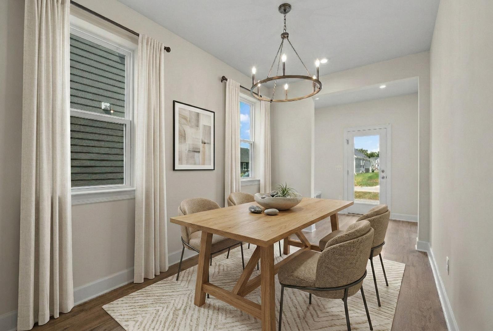 dining room with wood flooring, large windows, and a dining room table and chairs