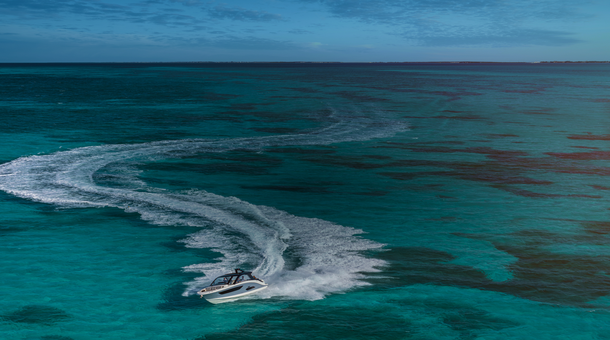 A speedboat sailing across the sea