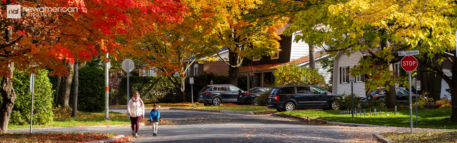 A serene neighborhood scene, showing tree-lined streets, people walking or biking, and homes with welcoming front porches