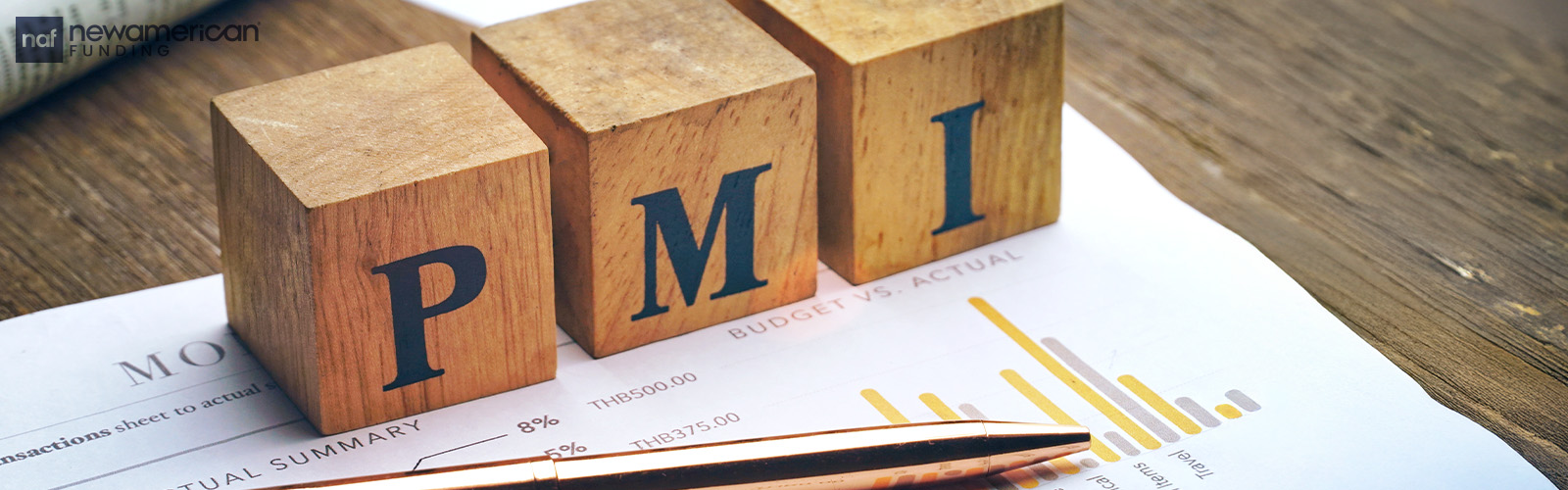 Blocks spell out PMI on a piece of paper with a gold pen in front of them.