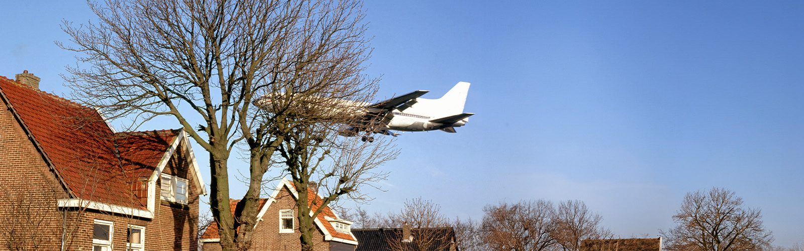 A plane flying over a neighborhood
