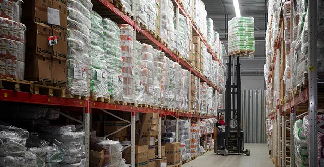 A warehouse with a forklift truck 