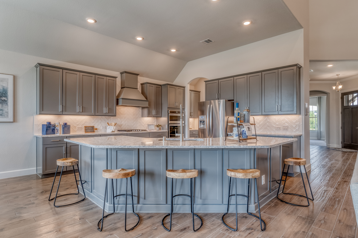 open kitchen with large island and hardwood floors