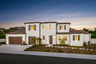 exterior of two-story home with three-car garage and desert landscaping
