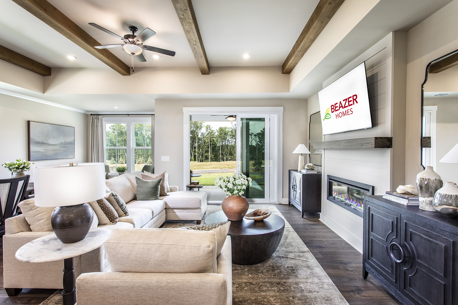 great room with electric fireplace & plank floors