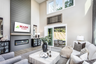 great room with electric fireplace & plank floors