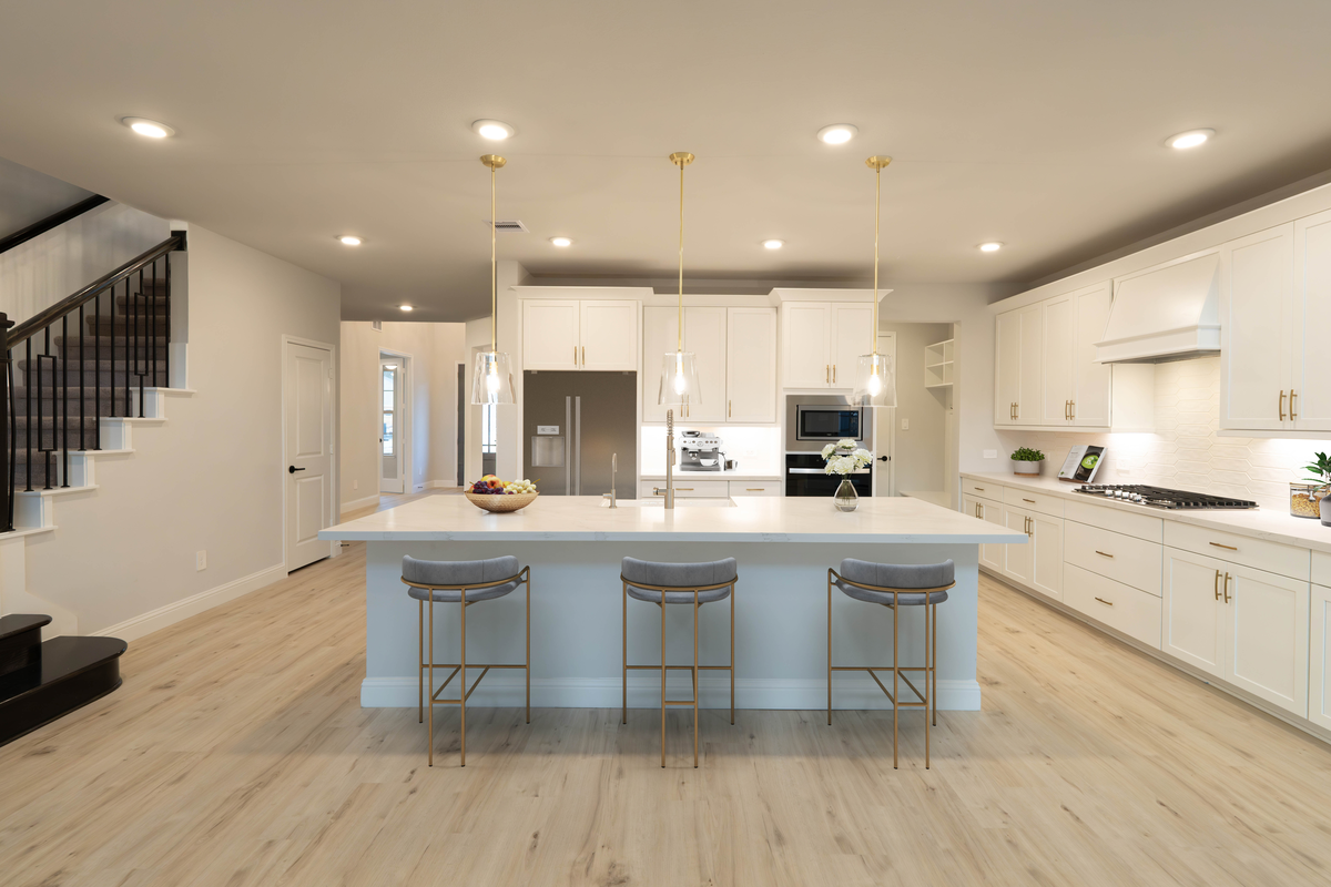 kitchen with white cabinets and pendant lighting