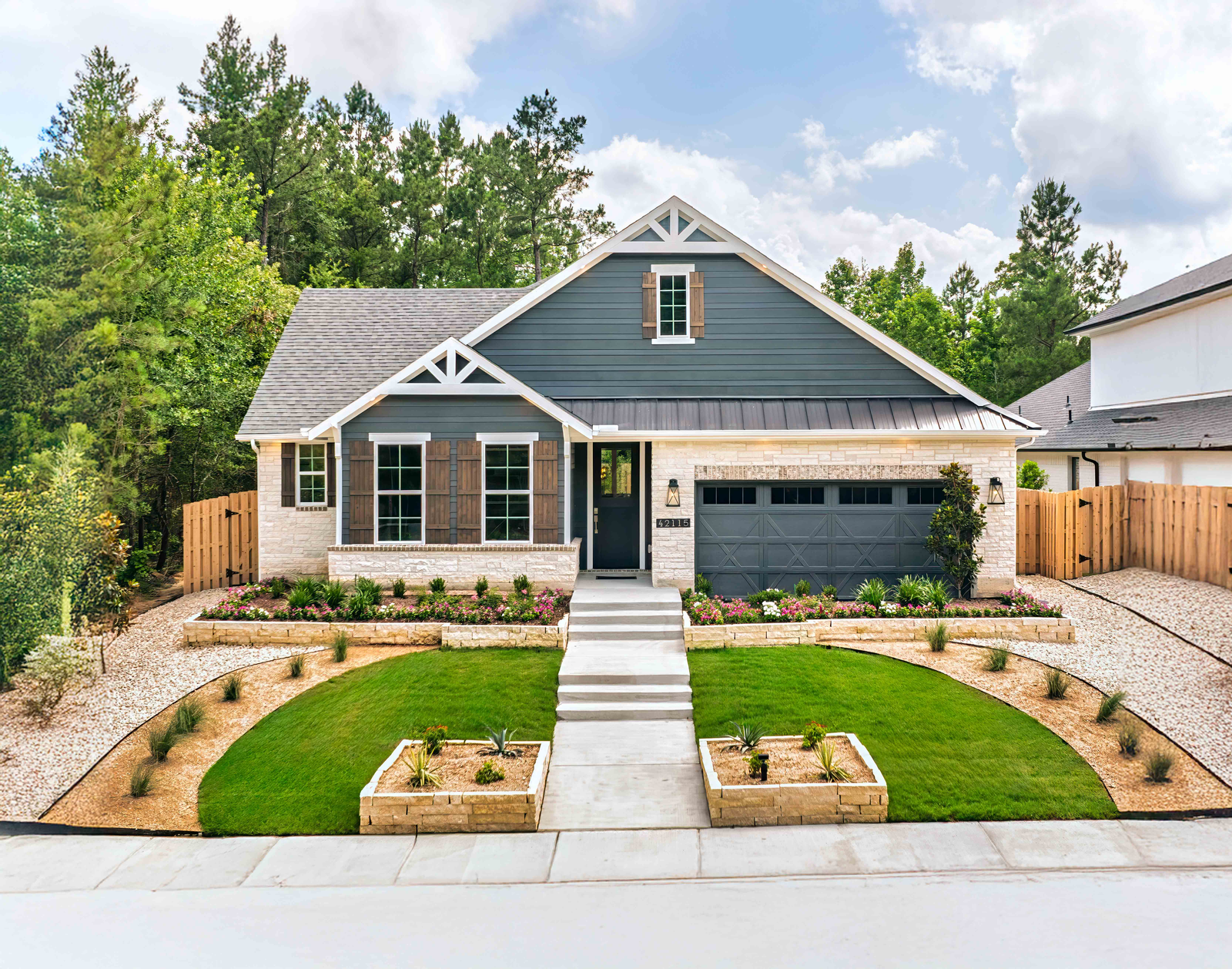 exterior stone and siding home with wood shutters