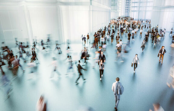 Aerial view of businesspeople walking through office lobby