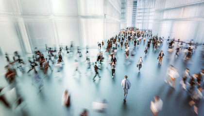 Aerial view of businesspeople walking through office lobby