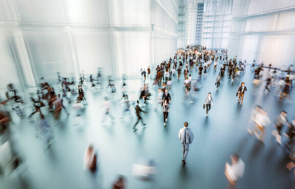 Aerial view of businesspeople walking through office lobby