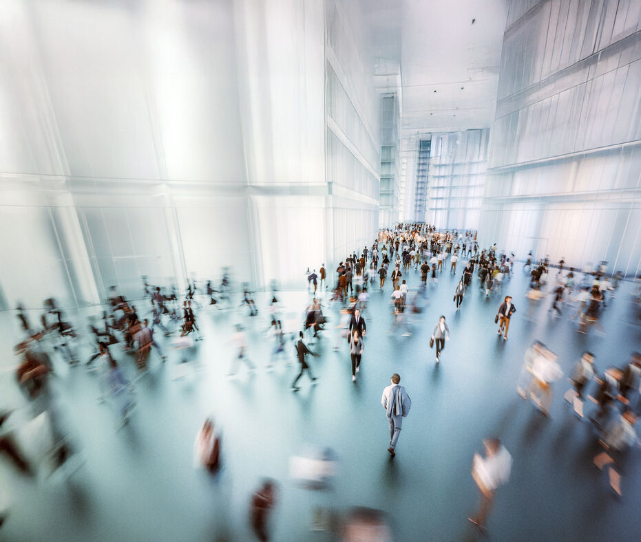 Aerial view of businesspeople walking through office lobby